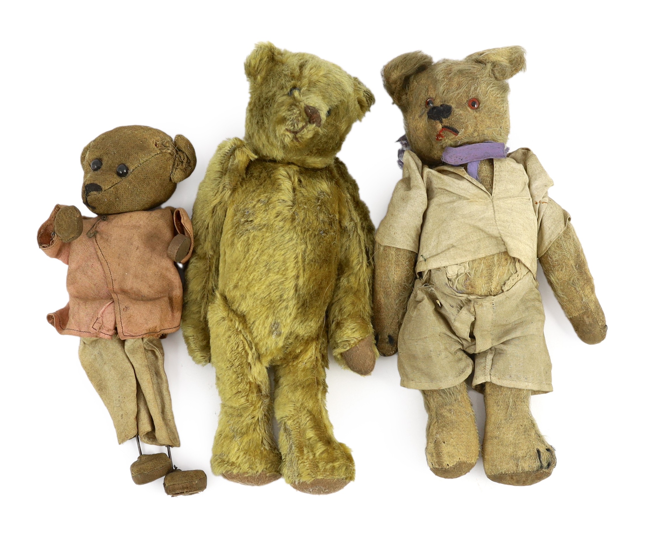 An early 20th century German Teddy bear, mohair plush and boot-button eyes, 12in., and two other Teddy bears